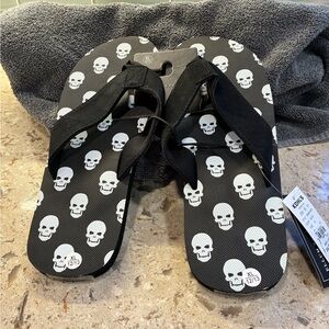 Bioworld Black Flip-Flops with White Skull Print